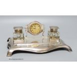 A George V silver desk standish with two silver topped inkwells and central timepiece, Robert