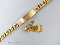 A yellow metal (stamped 750) curb link identity bracelet, 21cm and a 750 and diamond set pendant,