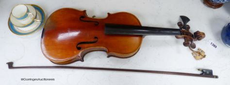 A Lowendall violin, labelled Stradivarius, 58cm long, together with a bow