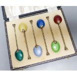 A cased set of six silver gilt and enamel coffee spoons, Birmingham, 1954.