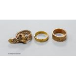 A bark textured 9 ct. rose gold ring, a small 18ct gold band (2.7 grams) and a two colour 9ct gold