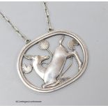 A George Jensen sterling 'kneeling deer' pendant necklace, design no. 95, 43mm, chain 58cm.