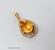 A 14k yellow metal and pear shaped citrine set drop pendant, 29m, gross 3.7 grams.