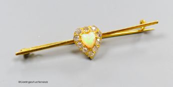 A yellow metal diamond and opal heart shaped bar brooch, 51mm, gross 3.7 grams.