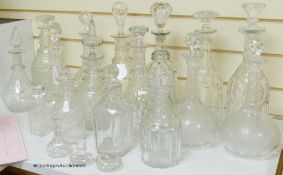 A collection of cut glass decanters, stoppers, etc.