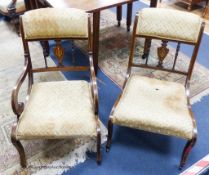 A pair of Edwardian inlaid mahogany drawing room chairs.