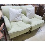 A pair of Howard style armchairs upholstered in lime green fabric. W-70, D-94, H-80cm.