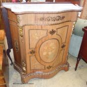 A Louis XV style marquetry inlaid, gilt metal mounted serpentine pier cabinet with white marble