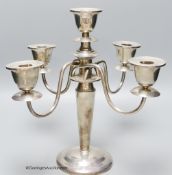 A white metal (stamped sterling) four branch, five light candelabrum, height 30.4cm, gross weight