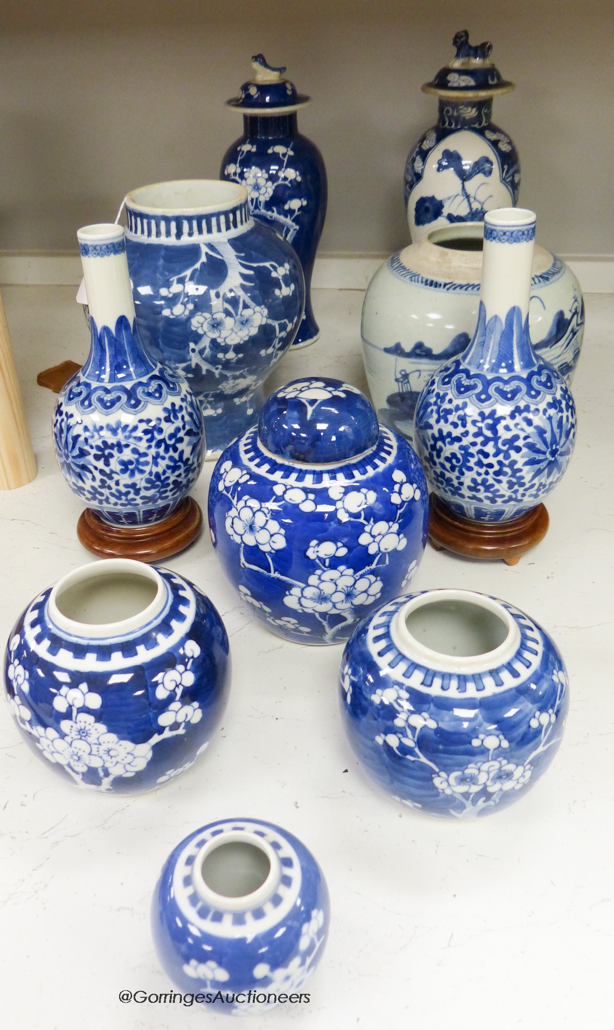 Ten 19th / 20th century Chinese blue and white vases and jars, tallest 29cm including cover