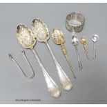 A pair of Edwardian silver berry spoons, minor flatware and an Indian? white metal napkin ring.