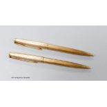 Two 9ct gold cased Parker pens.