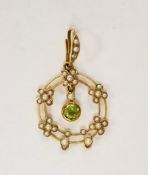 An early 20th century 9ct, peridot and seed pearl set drop pendant, overall 35mm, gross weight 2.1