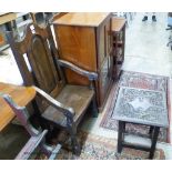 A 17th century style oak armchair and a square occasional table.