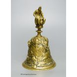 A French medieval style cast brass bell, 13cm high