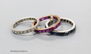 A white metal and diamond chip set full eternity ring, L/M, gross 2.2 grams and two other eternity