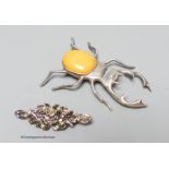 A silver and amber stag beetle brooch