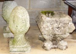 A pair of reconstituted stone acorn finials. H-42cm. Together with a stone garden planter.