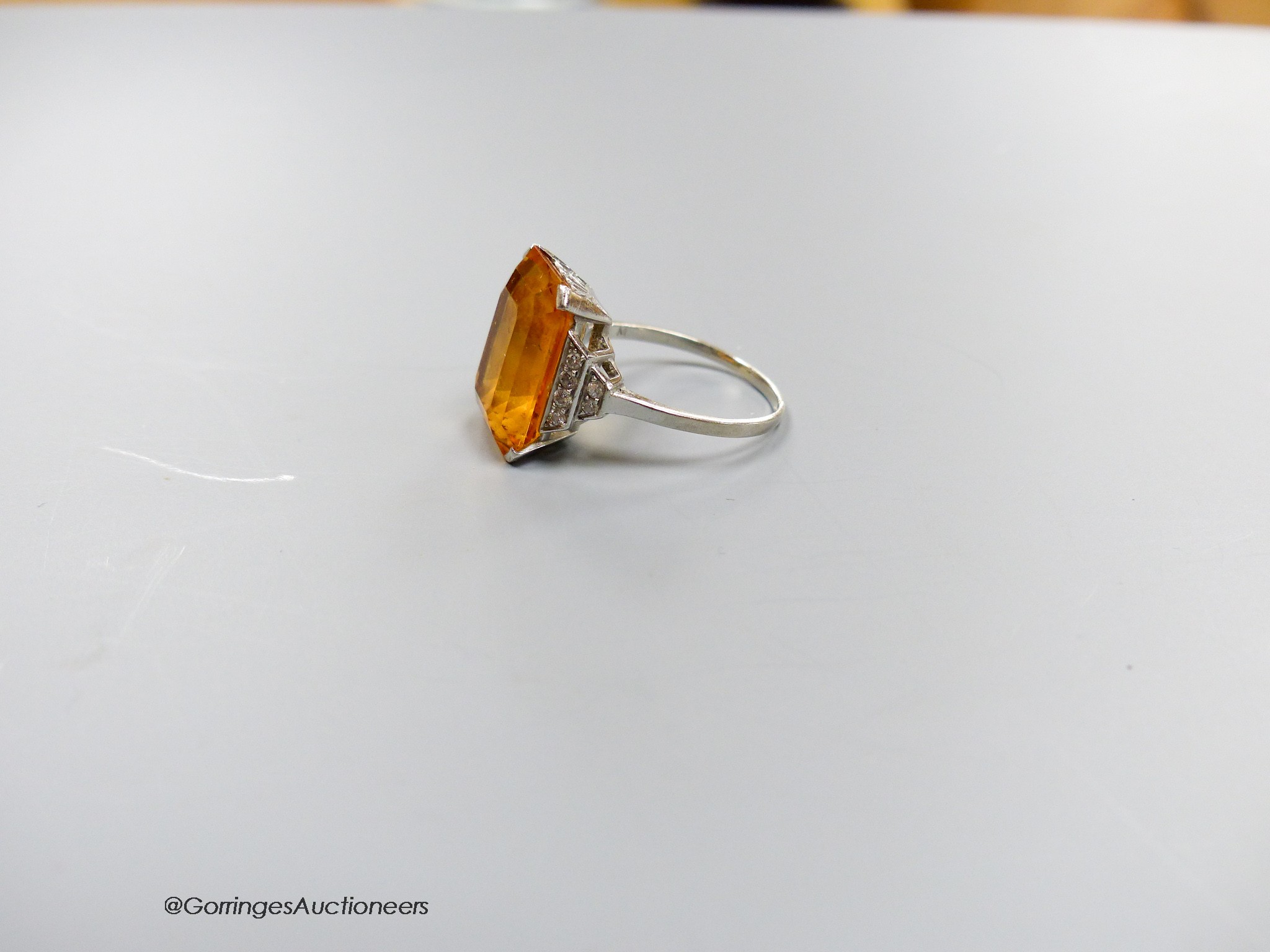 A white metal and emerald cut yellow topaz set dress ring, with diamond set shoulders, size N, - Image 2 of 2