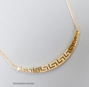 A modern 585 yellow metal and white stone set 'Greek key' pattern necklace, approx. 40cm, gross 8.2