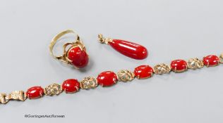 A modern 14k yellow metal mounted coral bracelet, pendant and ring, gross weight 13 grams.