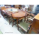 A reproduction George III Style mahogany D-end extending dining table, 236cm extended, 2 spare