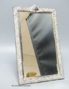 An Edwardian repousse silver mounted rectangular easel mirror, Deakin & Francis, Birmingham, 1904,