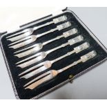 A cased set of George V Liberty & Co silver cake forks, Birmingham, 1934, 13cm, 102 grams.