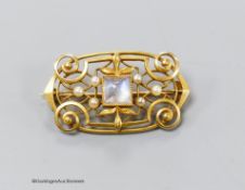 A 14k yellow metal openwork pendant brooch set with square-cut cabochon moonstone and six seed