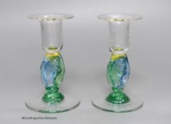 A pair of clear and coloured glass candlesticks by Helen Millard,the stems with fish design,