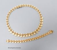 A modern 9ct gold necklace, 44cm and matching bracelet, 18cm,71 grams.