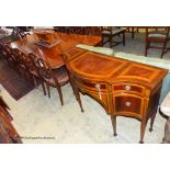 A reproduction Sheraton inlaid mahogany dining room suite, comprising twin pillar extending dining