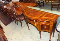 A reproduction Sheraton inlaid mahogany dining room suite, comprising twin pillar extending dining