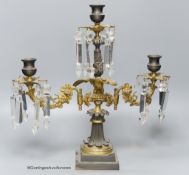 A 19th-century French bronze and ormolu three light candelabrum, 39cm high