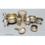 A group of small silver including a late Victorian repousse cannister, three salts, a caddy spoon,
