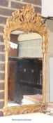 A 18th century gilt wood style wall mirror. W-46, H-100cm.