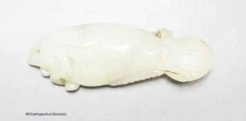 A Chinese pale celadon jade carving of a fish, 8.7 cm