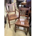 A set of six 19th century provincial fruitwood solid seat dining chairs, one with arms.