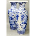 A pair of large Japanese blue and white vases (one a.f.), 60cm high