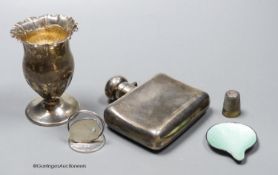 A George V silver hip flask, width 85mm, a small silver vase, a silver menu holder, a silver
