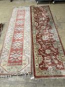 An Afghan Ziegler peach ground runner and another runner, largest 310 x 84cm