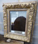 A Victorian giltwood and gesso rectangular wall mirror, with acanthus and floral mounts, W.53cm H.