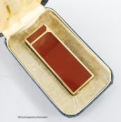A boxed red Dunhill lighter and a silver plated tobacco caddy