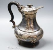 An Edwardian silver hot water pot, Goldsmiths & Silversmiths Co Ltd, London, 1909, gross 20oz.