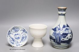 An 18th century Chinese blue and white bottle vase, together with a saucer and blanc de chine stem