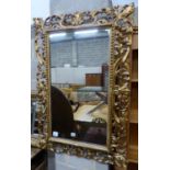 A 19th century Florentine carved gilt wood wall mirror, W.72cm H.108cm