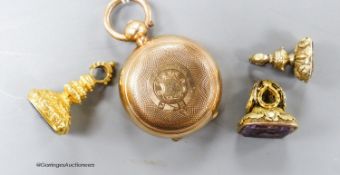 A gold plated sovereign case and three assorted yellow metal overlaid and gem set fob seals (one a.