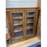 A late Victorian glazed walnut bookcase. W-112, D-28, H-138cm.