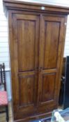 A hardwood two door cabinet, length 102cm, depth 68cm, height 201cm
