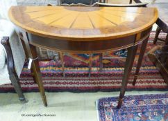 A reproduction Sheraton style inlaid satinwood D shaped consul table, length 114cm, depth 49cm,